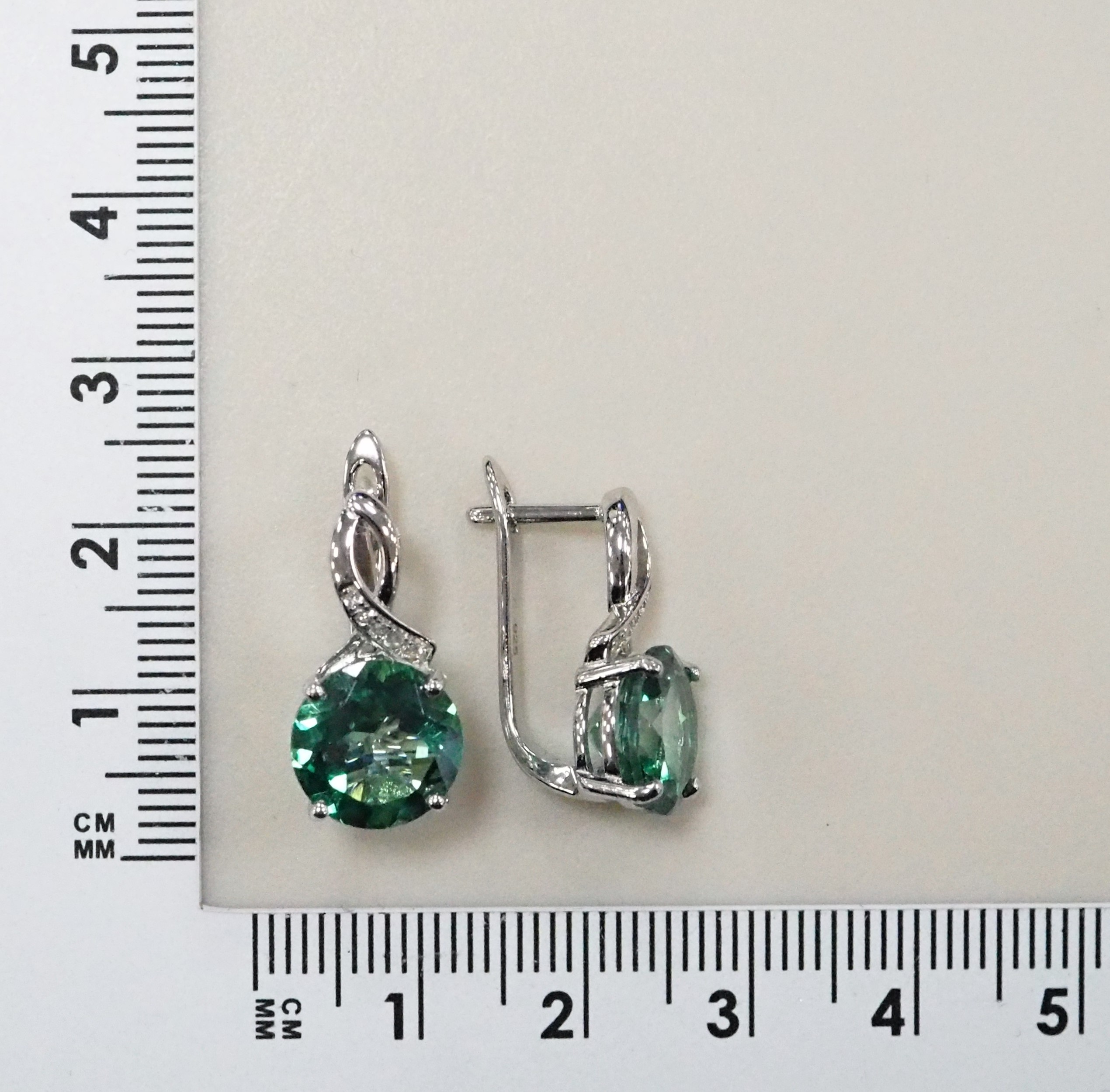 Серебряные серьги 925 пробы; вставки 2 Топаз 8,75ct; 10 Топаз белый 0,08ct;